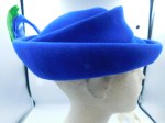 blue hat green feather side b